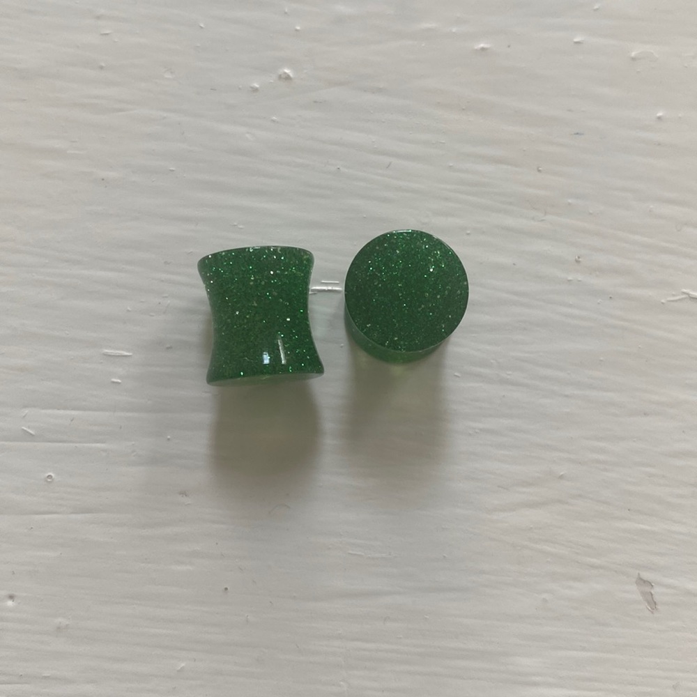 00g glittery green double flared plugs